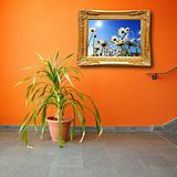 picture on a wall and plant
