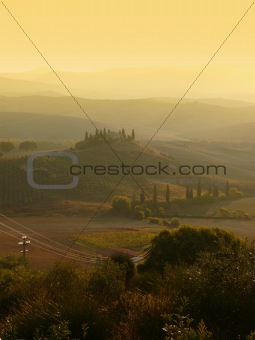 Tuscany sunrise over hills and villa