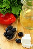 Ingredients for a Greek salad pepper, olives and butter