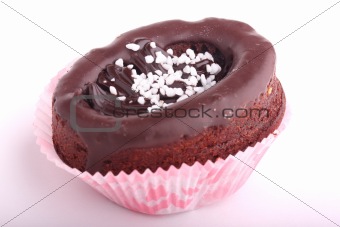 Chocolate cupcake decorated with chocolate frosting isolated on white background