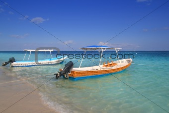 boats in caribbean beach turquoise sea 