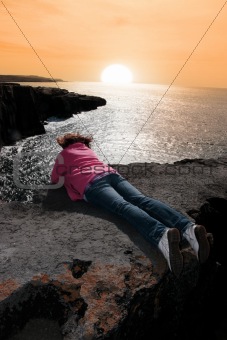 lone woman on cliffs edge