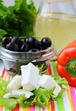 Ingredients for a Greek salad pepper, olives and butter