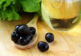 black olives and a bottle of olive oil