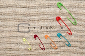Safety Pins On Canvas