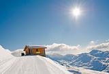 Isolated mountain hut in the sun