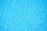 blue swimming pool with ripple water and reflection