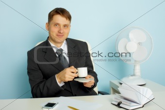 Attractive young man with a cup of coffee