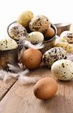 Brown and white speckled eggs on table