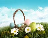 Easter eggs with  basket in the grass