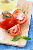Fresh ripe tomatoes with basil and olive oil