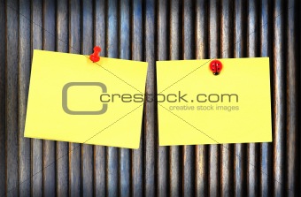 yellow note and wood background