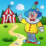 Funny clown with circus tent