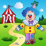 Smiling clown with circus tent