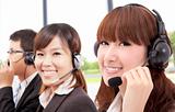 Smiling business customer service team on the phone