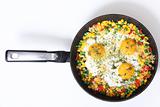 Eggs and vegetables in a frying pan