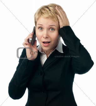 young business woman shocked by phone talk