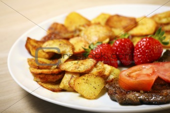 Beef steak with sliced potatoes