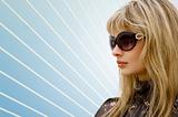 blond woman with sun glasses