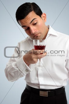 Man inspecting wine
