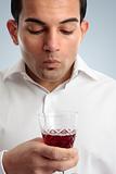 Man tasting red wine