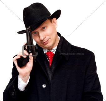 Man in suit, red tie with gun