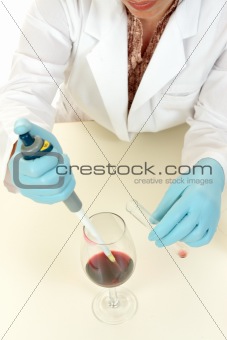 Scientist using pipette to take sample