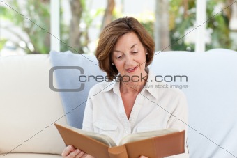 Old woman reading her book