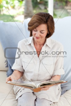 Retired woman reading her book
