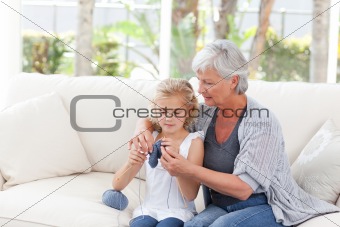 Senior knitting with her granddaughter