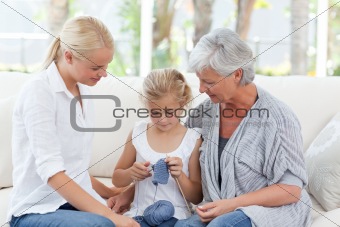 Family knitting together at home