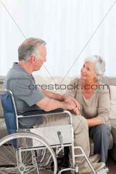 Woman with her husband in a wheelchair