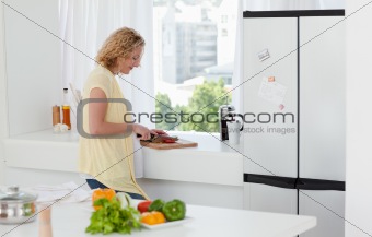 Attractive woman cooking at home