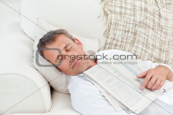 Exhausted man sleeping on the couch