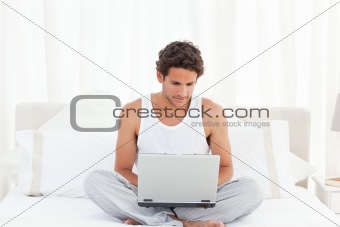 Man working on his laptop at home