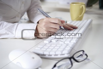 Writing on a white computer keyboard