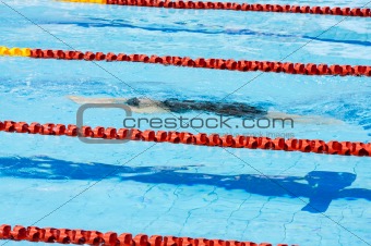 swimmer swimming in a pool 