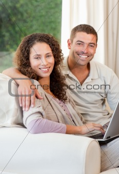 Couple working on their laptop at home