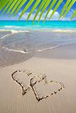 hearts in love written in Caribbean beach sand