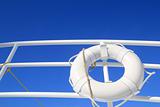 boat buoy white hanged in railing summer blue sky