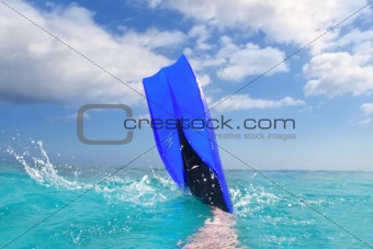 Diving blue fin splashing in Caribbean surface
