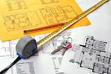 Tools on Blueprints including measuring tape, keys and pencil