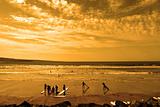 student surfers glorious sunset beach