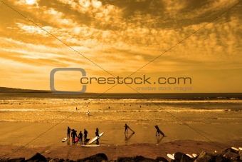 student surfers glorious sunset beach