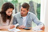 Pessimistic couple stressed with so many bills to pay