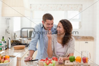 Man eating vegetables with his wife