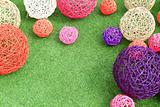 color rattan ball on green grass.
