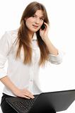 business woman with laptop speaks via phone