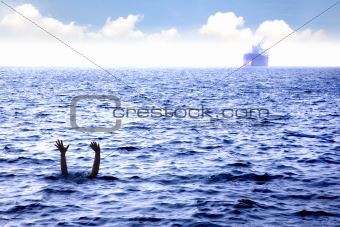 man drowning in the sea and waving hand for help