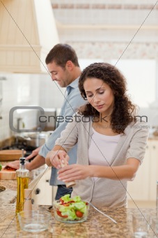 Handsome man cooking with his girlfriend